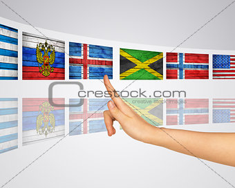 Theme flags. Finger presses one of virtual screens