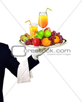 Waiter serving fruits and orange juice