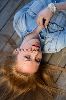 Fashion portrait of strict red-haired girl,