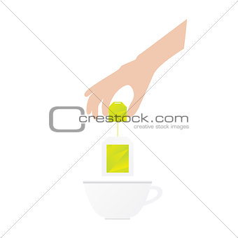 Humans hand is holding tea bag