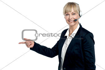 Active employee pointing towards the copy space area