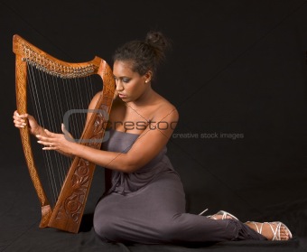 African-American woman with harp