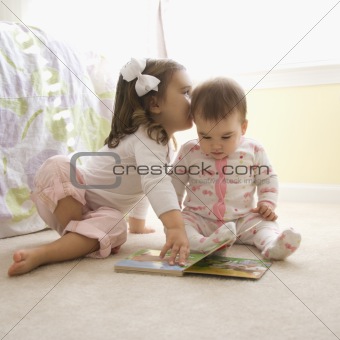 Girls with book.