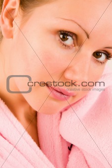 beautiful woman in pink bathrobe