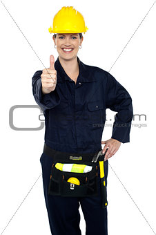 Confident lady worker showing thumbs up