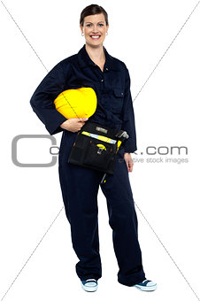 Relaxed construction worker with yellow helmet