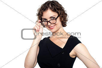 Pretty lady adjusting her eyeglasses