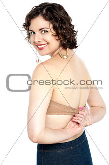 Passionate hot woman adjusting her bra