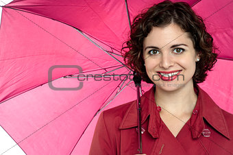 Beautiful woman holding an open umbrella