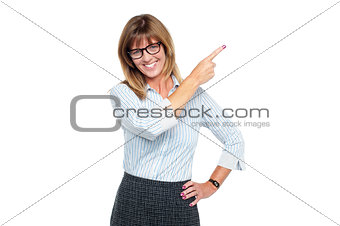 Charming business professional pointing away