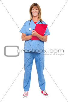 Smiling confident doctor holding clipboard