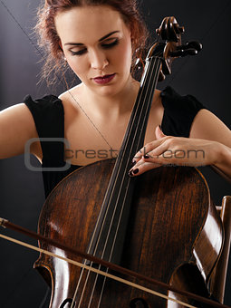Closeup of a beautiful cellist