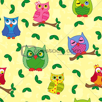 Seamless pattern with ornamental owls over yellow