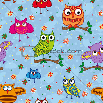 Seamless pattern with ornamental owls over light blue