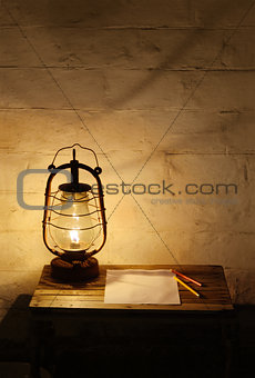 Kerosene lantern on wooden table
