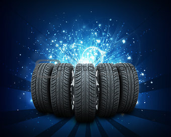 Wedge of new car wheels. Abstract blue background