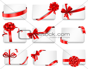 Festive cards with red gift ribbons.