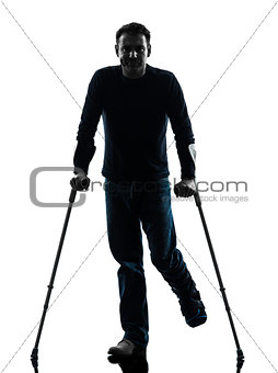 injured man with crutches silhouette