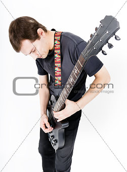 man with a black electric guitar