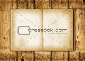 Note book on a wood background