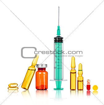 syringe with the needle, medical ampoules on a white background