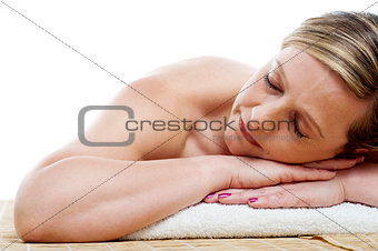 Cropped image of woman relaxing at spa centre