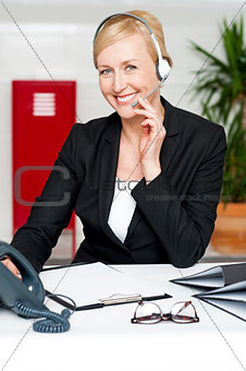 Customer support staff holding mic and communicating