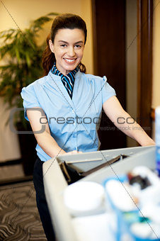 Housekeeping executive pushing the cart