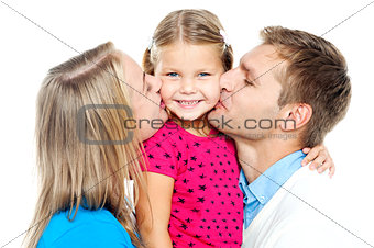 Mom and dad kissing their beautiful kid