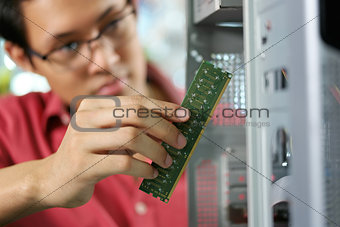 Portrait Of Chinese Man Reparing PC In Computer Shop