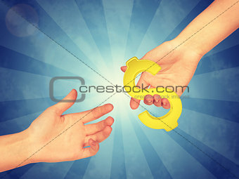 Hand passing gold dollar