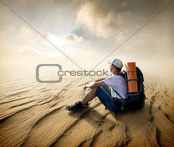 Tourist in sand desert