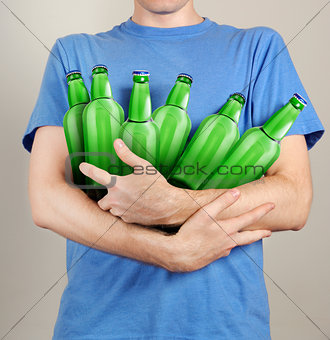 Consumer with a lot of bottles of beer in their hands