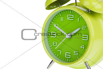 Green alarm clock isolated on white