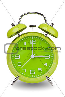 Green alarm clock with hands at 3 am or pm
