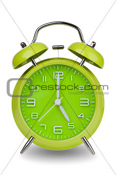 Green alarm clock with hands at 5 am or pm