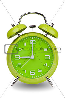 Green alarm clock with hands at 9 am or pm