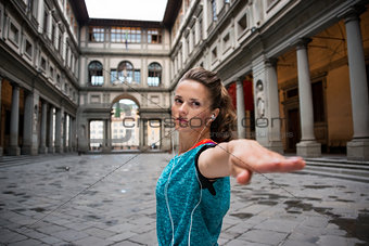 Fitness woman workout near uffizi gallery in florence, italy