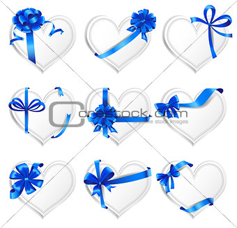 Set of beautiful heart-shaped cards with blue gift bows.
