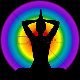 Human silhouette in yoga pose with aura and chakras colors on ba