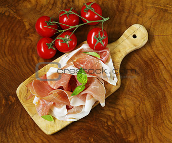 parma ham (jamon) with fragrant herbs traditional Italian meat appetizer