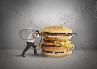 Man pushes a sandwich