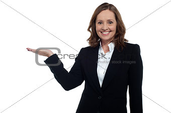 Middle aged corporate woman showing copy space