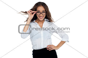 Young businesswoman adjusting her spectacles