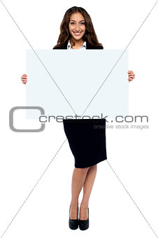 Corporate woman displaying blank whiteboard