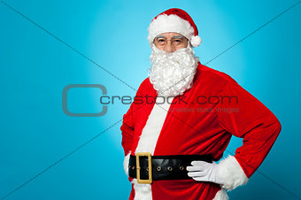 Aged Santa posing with hands on his waist