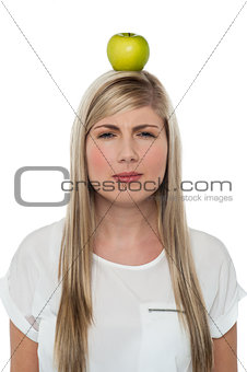 Woman with apple on her head
