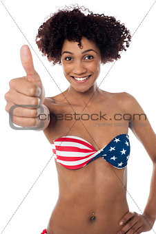 Stars and stripes bikini model showing thumbs up