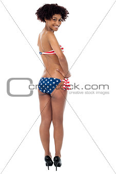25 years young woman in swimsuit with american flag