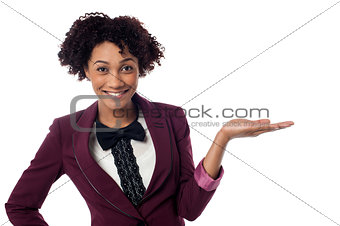 Smiling woman presenting copy space area
